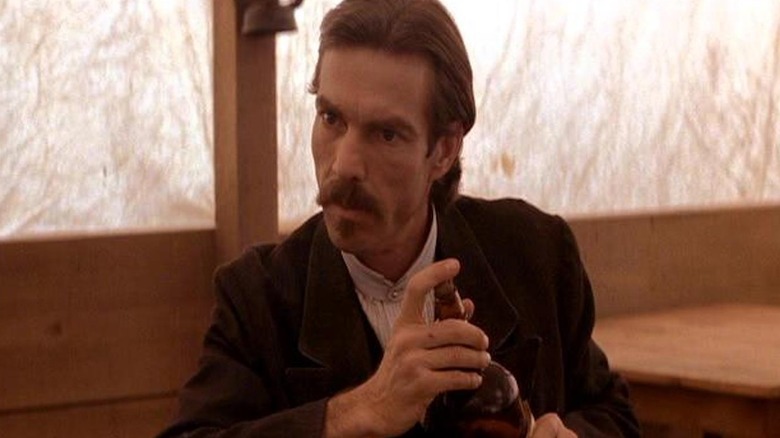 Dennis Quaid as Doc Holliday in Wyatt Earp