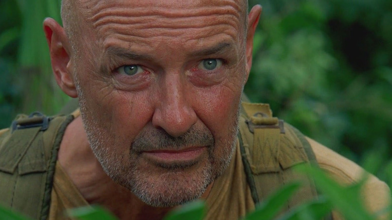 Locke watches from the jungle in Lost