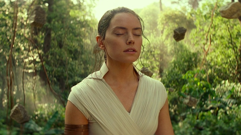 Daisy Ridley as Rey meditating in a forest in Star Wars: The Rise of Skywalker