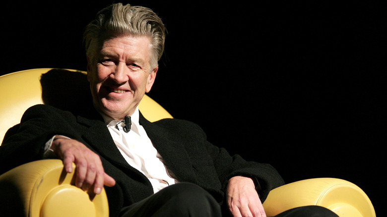David Lynch seated and smiling for interview