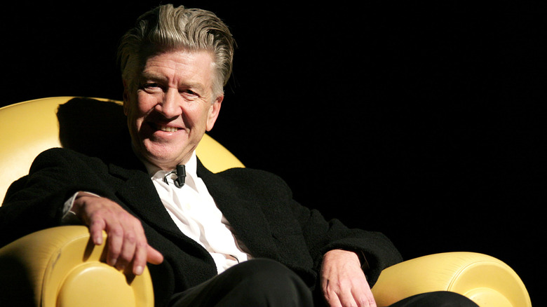 David Lynch seated and smiling for interview