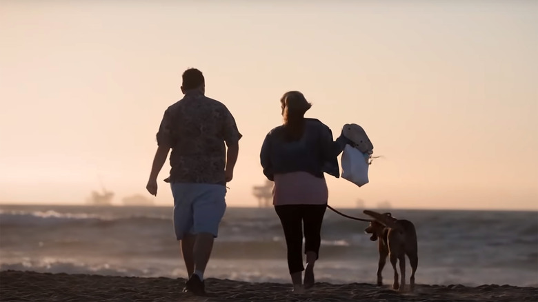 Characters from Love on the Spectrum U.S. running on the beach with a dog