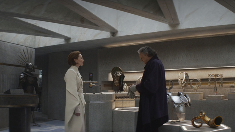 Genevieve O'Reilly and Stellan Skarsgård in Andor with cultural trinkets
