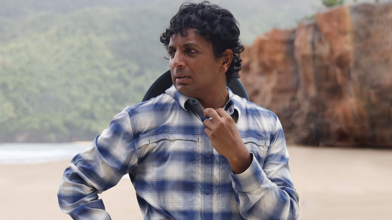 M. Night Shyamalan on the beach filming Old