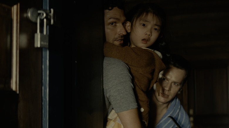 Ben Aldridge, Kristen Cui, and Jonathan Groff in Knock at the Cabin