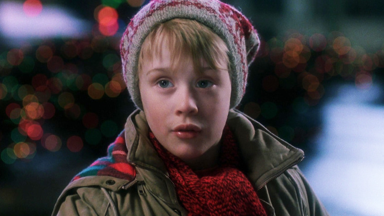 Macaulay Culkin's Kevin McCallister stands outside wearing a hat in Home Alone