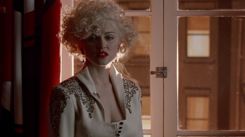 Breathless Mahoney standing by a window in Dick Tracy