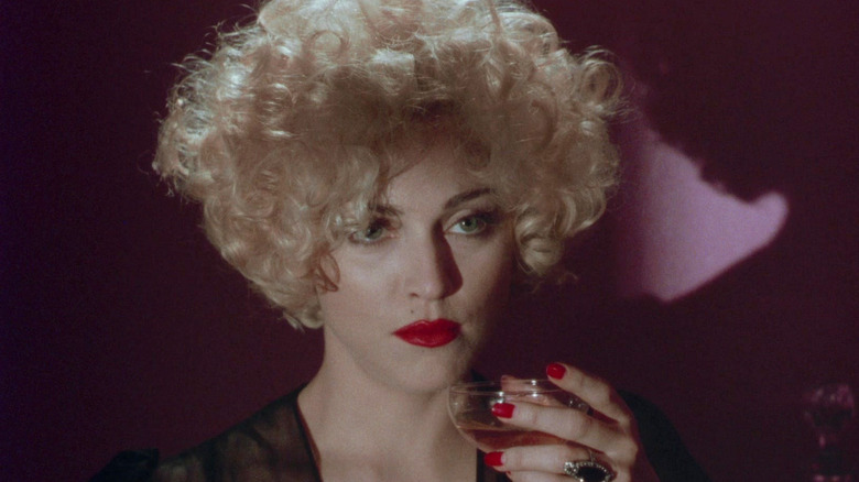 Breathless drinking a cocktail in Dick Tracy