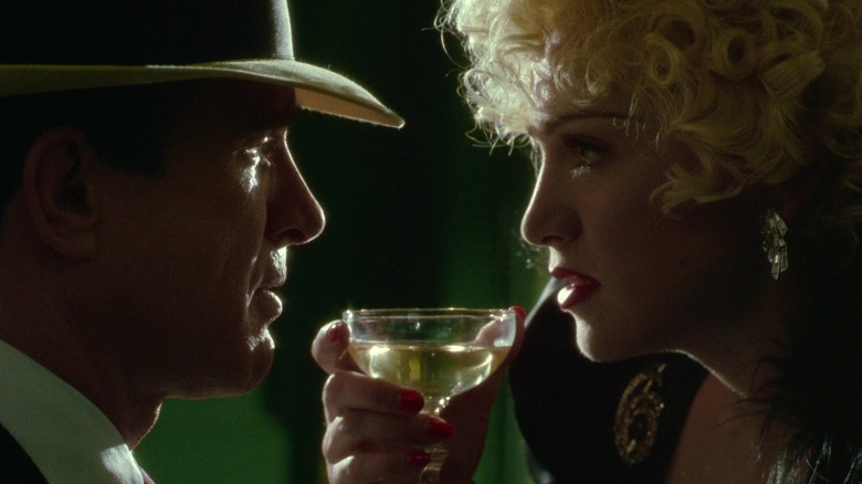 Dick Tracy and Breathless Mahoney very close over a cocktail in Dick Tracy