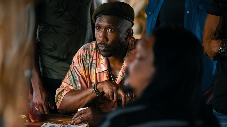 Mahershala Ali as Duncan Kincaid listening intently in Jurassic World Rebirth