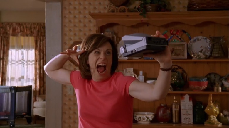 Jane Kaczmarek as Lois taking a photo of herself on Malcolm in the Middle