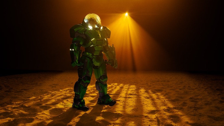 Nicholas Hoult as Lex Luthor suited up in a green warsuit in the middle of a desert setting on the set of Man of Tomorrow