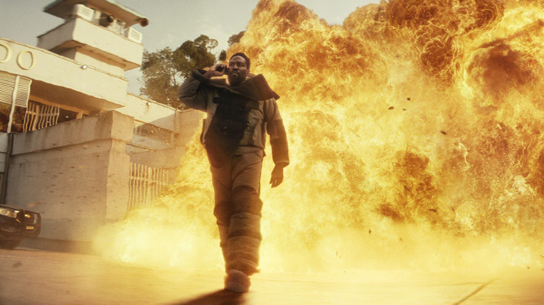 John Creasy walking away from an explosion