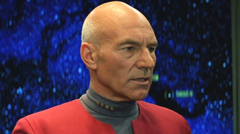 Captain Picard standing against a starfield background in Star Trek: Generations