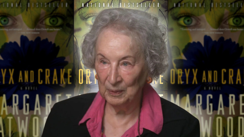 Margaret Atwood in interview headshot against the background of Oryx and Crake book covers