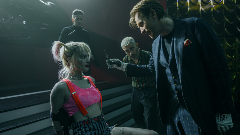 Roman Sionis threatening a tied-up Harley Quinn in Birds of Prey
