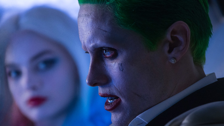 Joker (Jared Leto) sits right next to Harley Quinn (Margot Robbie) in "Suicide Squad"