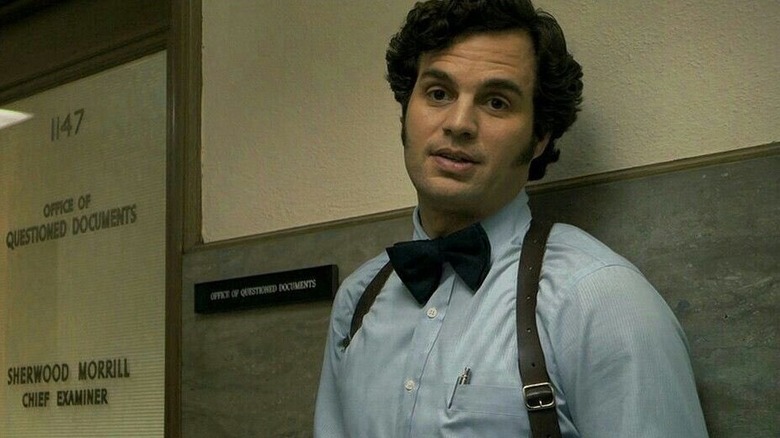 Dave Toschi (Mark Ruffalo) stands by an office door in Zodiac