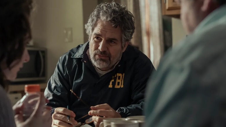 Mark Ruffalo as Tom Brandis questioning a couple and taking notes on Task
