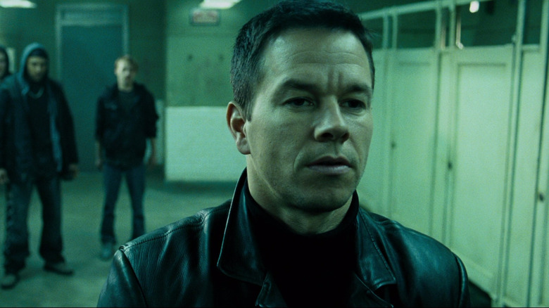 Mark Wahlberg's Max Payne is surrounded by three henchmen in a bathroom in Max Payne