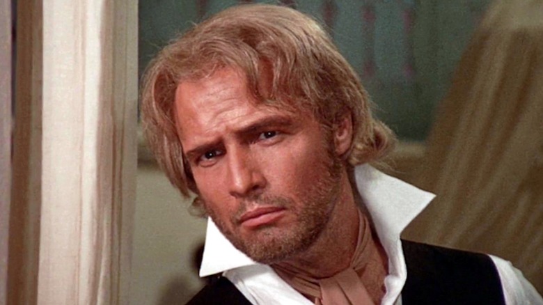Marlon Brando looks a tad skeptical as Sir William Walker in Burn!