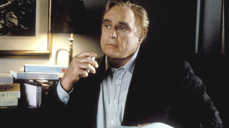 Dr, Mickler talking into a tape recorder in Don Juan DeMarco