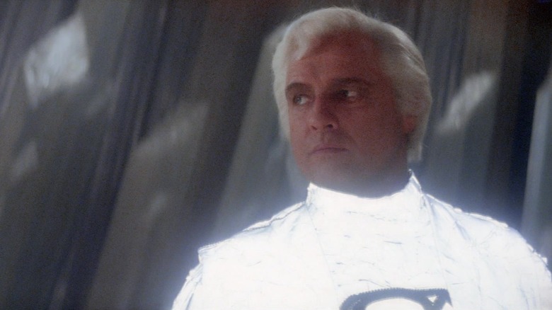 Marlon Brando's Jor-El looks off to his right wearing a white suit in Superman