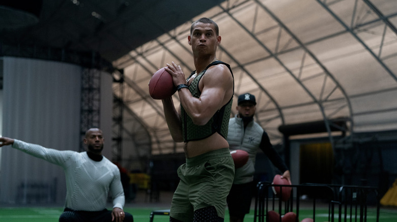 Cam about to throw a football in Him