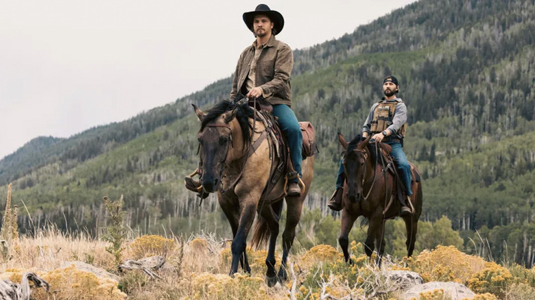 Luke Grimes' Kayce Dutton rides a horse in front of Logan Marshall-Green's Pete Calvin in Marshals