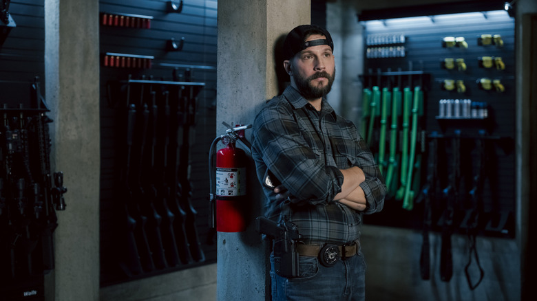 Logan Marshall-Green's Pete Calvin stands against a pillar in an armory in Marshals