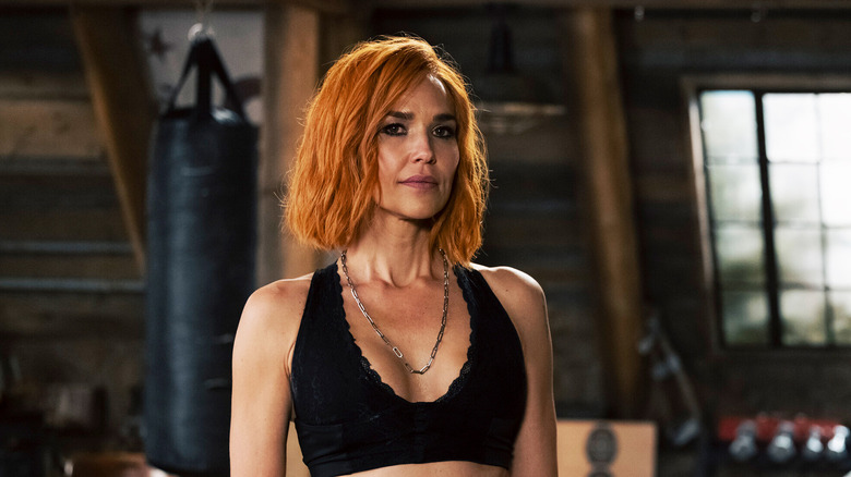 Arielle Kebbel's Belle Skinner stands in the Marshals' rec room in Marshals