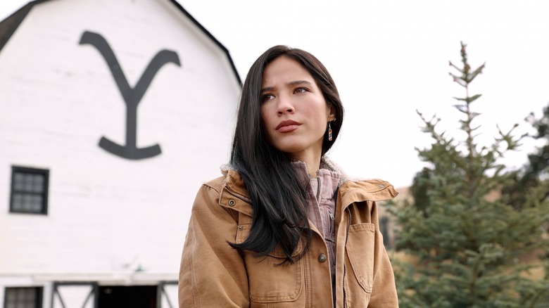 Monica Dutton (Kelsey Asbille) standing outside of the Dutton Ranch alone on Yellowstone