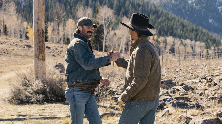 Riley Green's Garrett greets Luke Grimes' Kayce Dutton outside in Marshals