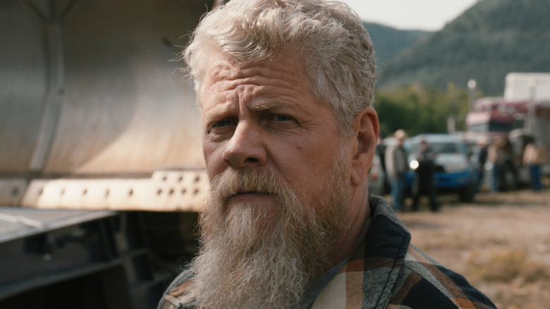 Michael Cudlitz's Randall Clegg is seen in closeup as he stands outside in Marshals.jpg