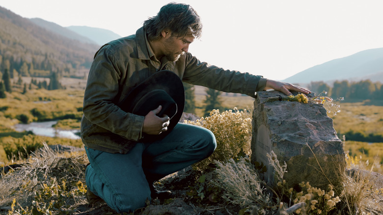 Luke Grimes' Kayce Dutton kneels at the grave of his wife in Marshals
