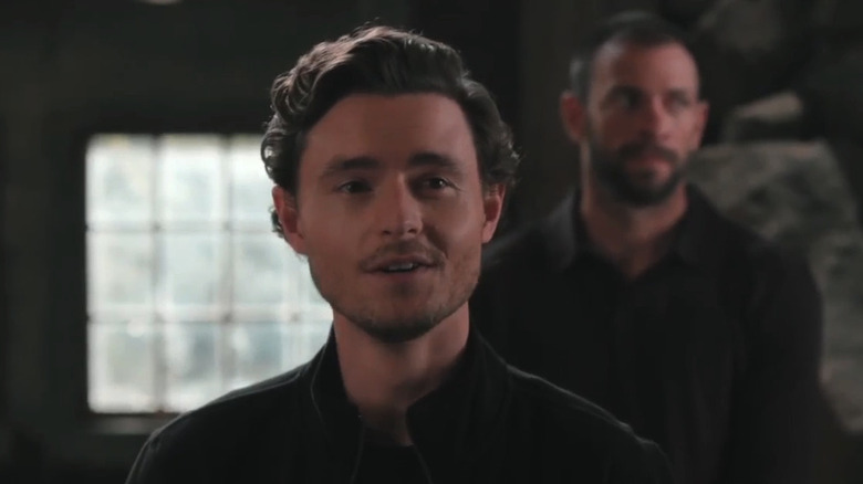 Gavin Escher is seen smirking in closeup in Marshals