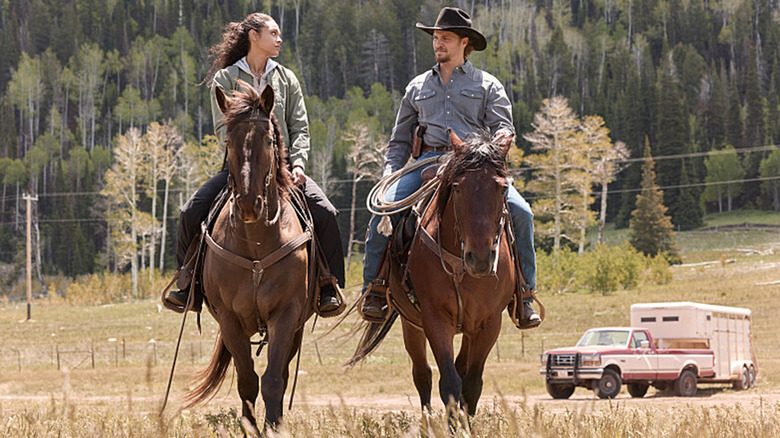 Ash Santos' Andrea Cruz and Luke Grimes' Kayce Dutton ride horses together in Marshals