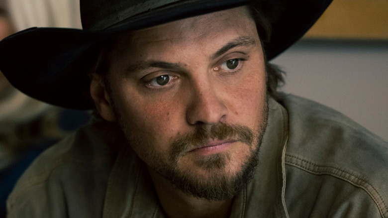 Luke Grimes' Kayce Dutton looks off into the distance in closeup in Marshals