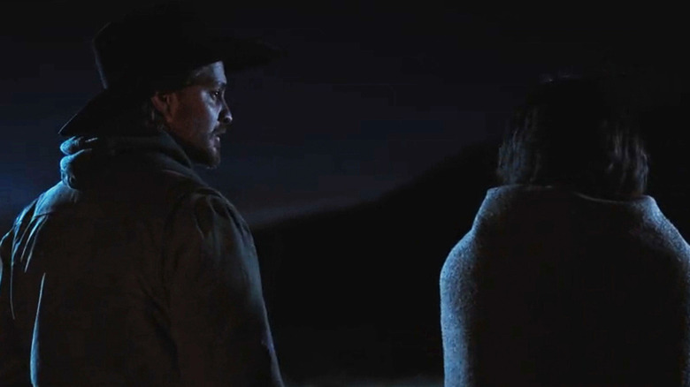 Luke Grimes' Kayce Dutton looks his right as he stands next to Ash Santos' Andrea Cruz in Marshals