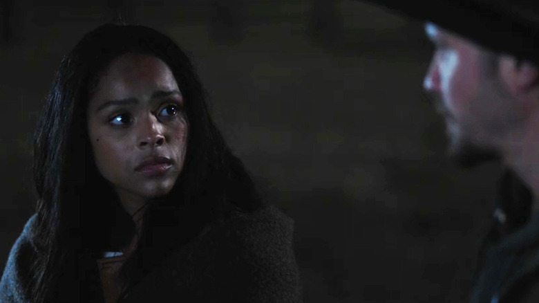 Ash Santos' Andrea Cruz looks up at Luke Grimes' Kayce Dutton in Marshals