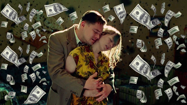 Leonardo DiCaprio's Teddy clutching Michelle Williams' Dolores as she disappears surrounded by money in Shutter Island
