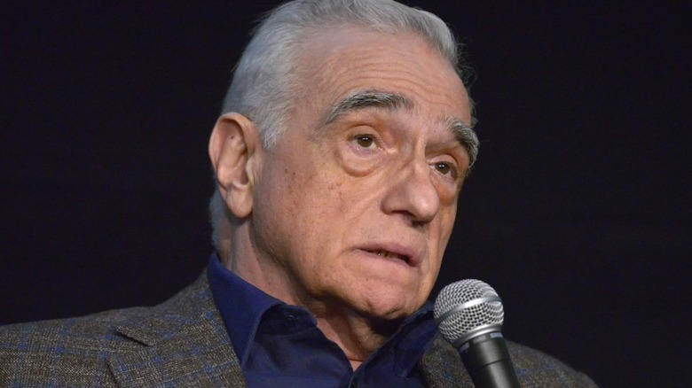 Martin Scorsese speaks into a microphone