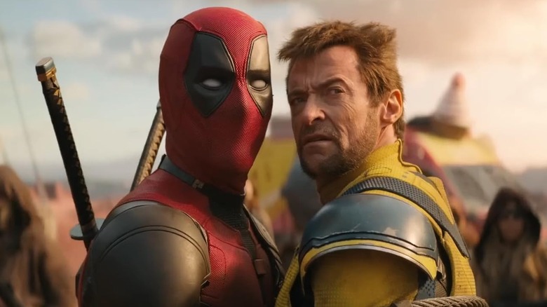 Wade Wilson/Deadpool (Ryan Reynolds) and Logan/Wolverine (Hugh Jackman) roped together as prisoners in The Void in Deadpool & Wolverine (2024)