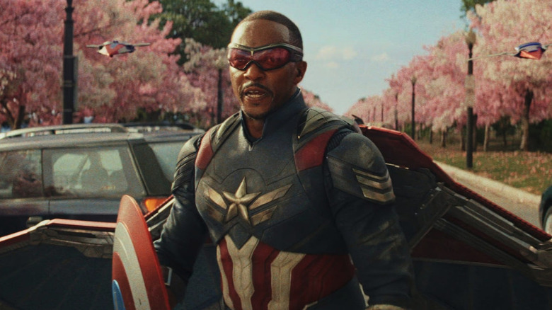 Sam (Anthony Mackie) stands with drones flanking him in Captain America: Brave New World