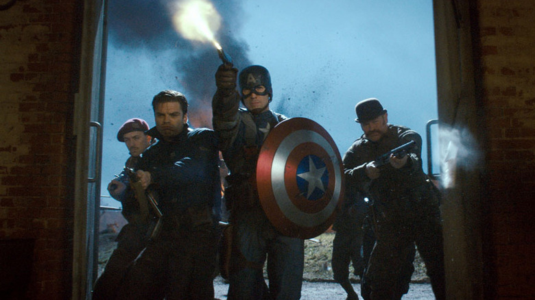 Steve Rogers (Chris Evans), Buck Barnes (Sebastian Stan) and fellow soldiers charge into a military warehouse in Captain America: The First Avenger
