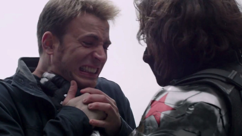 Bucky (Sebastian Stan) holding Steve Rogers (Chris Evans) by the throat in Captain America: The Winter Soldier