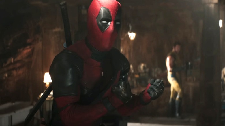 Deadpool talking with Wolverine in the background