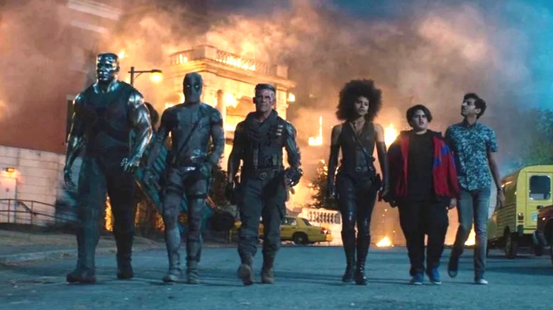 X-Force walking toward the camera with an explosion in the background