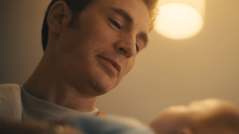 Chris Evans as Steve Rogers holding his baby in Avengers: Doomsday
