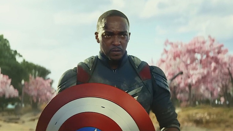 Anthony Mackie as Sam Wilson, standing with the cherry blossom in Captain America: Brave New World